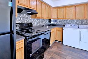 Baltimore townhouse for rent - a kitchen with a stove and a refrigerator