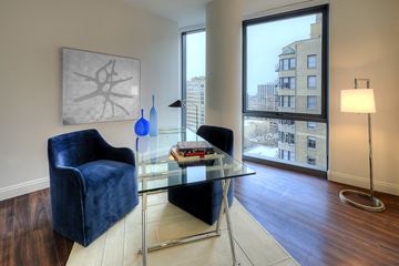 Chicago apartment for rent - a living room with a glass table and a window