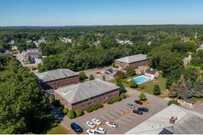 Lowell apartment for rent - an aerial view of a campus with buildings and a swimming pool