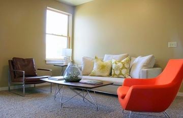 Missoula apartment for rent - a living room with a couch and chairs and a table