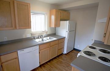 Missoula apartment for rent - a kitchen with a stove and a refrigerator