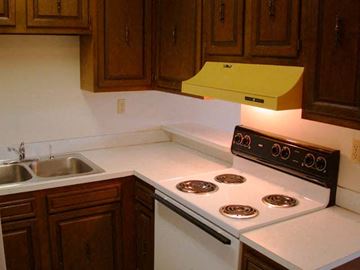 Laurel apartment for rent - a kitchen with a stove top oven and a sink