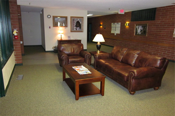 Anaconda apartment for rent - a living room with leather couches and a coffee table