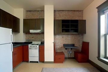 Missoula apartment for rent - a small kitchen with a stove and a refrigerator