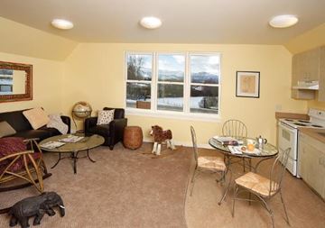 Missoula apartment for rent - a living room with a kitchen and a table and chairs
