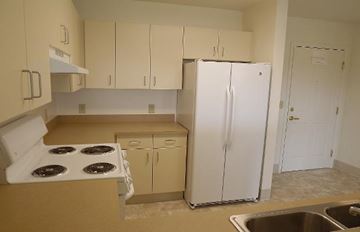 Missoula apartment for rent - a kitchen with a stove and a refrigerator