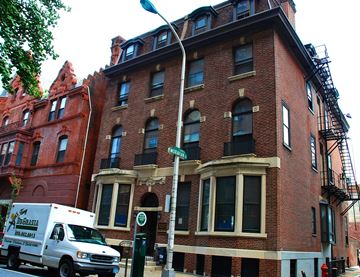 Philadelphia apartment for rent - a truck is parked in front of a brick building