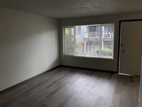 Everett apartment for rent - A room with a view of a balcony through the window.