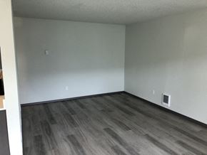 Everett apartment for rent - A room with a grey floor and white walls.