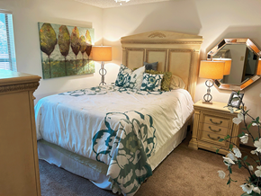 Rogers apartment for rent - a bedroom with a bed and two lamps and a dresser