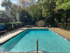 Rogers apartment for rent - a swimming pool with a fence around it