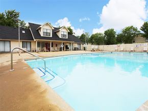 Rogers apartment for rent - a swimming pool with a house in the background