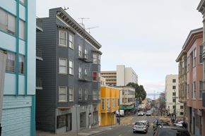San Francisco apartment for rent - A street view of a city with cars and buildings.