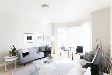San Francisco apartment for rent - a living room with a couch and a glass table