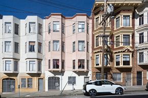 San Francisco apartment for rent - a car parked in front of a building on a city street