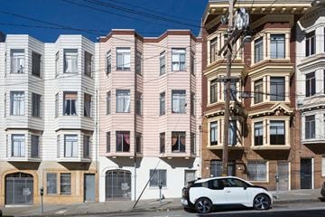 San Francisco apartment for rent - a car parked in front of a building on a city street