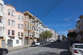 San Francisco apartment for rent - a city street with cars parked on the side of a