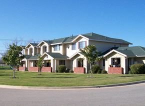 Temple apartment for rent - a row of houses with trees in front of them