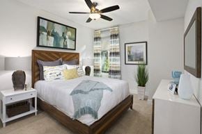 Hanover apartment for rent - A bedroom with a bed, nightstand, and a ceiling fan.