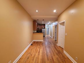 Chicago apartment for rent - a renovated living room and kitchen with wood floors