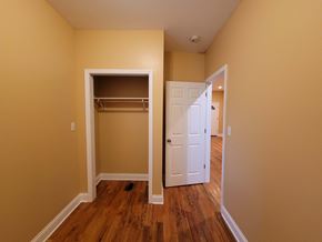 Chicago apartment for rent - a bedroom with a closet and an open door