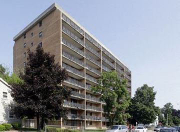 Worcester apartment for rent - an apartment building with cars parked in front of it