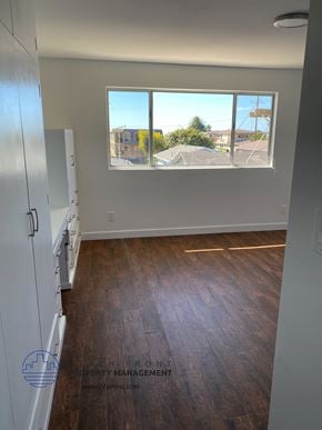 San Pedro apartment for rent - a view of the living room from the kitchen of an empty apartment