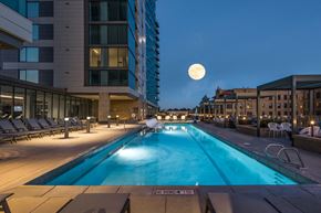 Denver apartment for rent - a swimming pool at night with a full moon