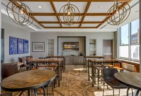 Denver apartment for rent - a dining room with tables and chairs and a bar