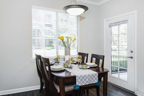 Denver apartment for rent - A dining room with a table set for a meal.