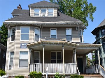 New Haven apartment for rent - A two-story house with a balcony on the second floor.