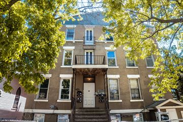 New Haven apartment for rent - A brown building with a white door and windows.