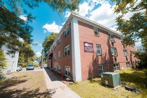 New Haven apartment for rent - A red brick building with a sign on it.