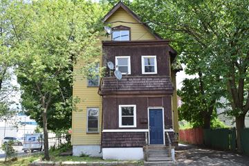 New Haven apartment for rent - A two-story house with a blue door and windows.