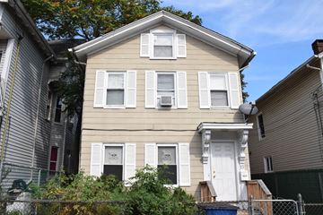 New Haven apartment for rent - A two-story house with a white door and windows.