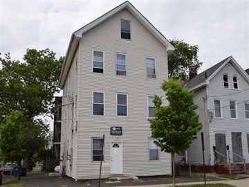 New Haven apartment for rent - A two story building with a white door and windows.