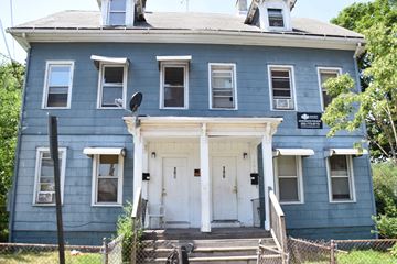 New Haven apartment for rent - A blue house with a white door and windows.