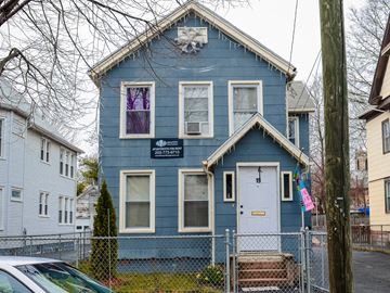 New Haven apartment for rent - A blue house with a white door and windows.