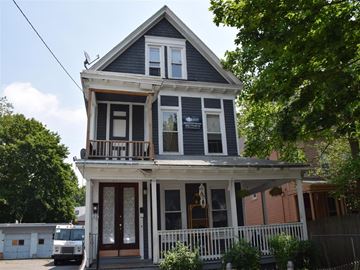 New Haven apartment for rent - A two-story house with a balcony and a porch.
