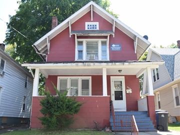 New Haven apartment for rent - A red house with a white door and a sign on the front.
