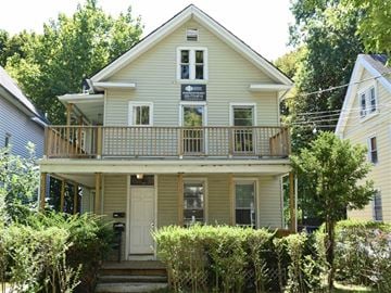 New Haven apartment for rent - A two-story house with a balcony on the second floor.