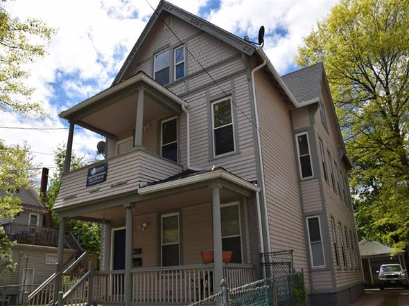 New Haven apartment for rent - A two-story house with a balcony and a porch.
