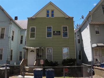 New Haven apartment for rent - A green house with a sign on the front.