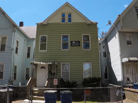 New Haven apartment for rent - A green house with a sign on the front.
