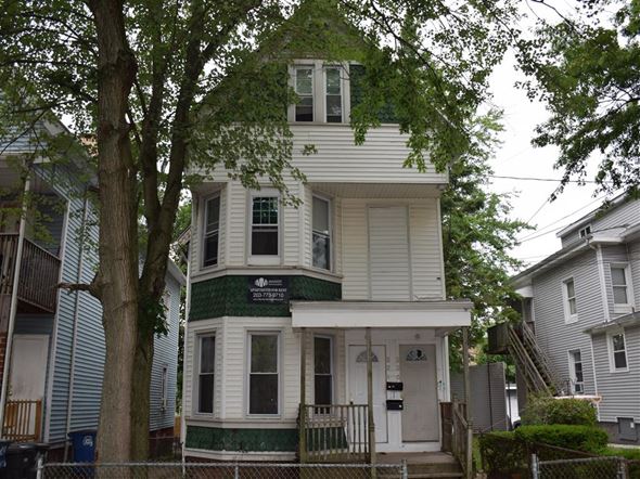 New Haven apartment for rent - A two story house with a green trim.