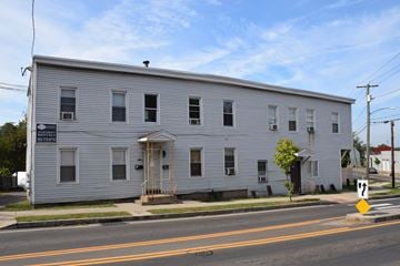 New Haven apartment for rent - A white building with a sign that says "Mini Mart" on it.