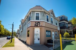 New Haven apartment for rent - A building with a sign that says "LLC" on it.