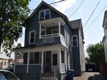 New Haven apartment for rent - A two-story house with a balcony on the second floor.