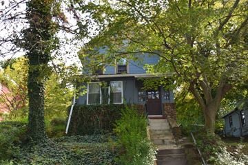 New Haven apartment for rent - A house with a staircase leading to the front door.