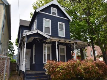 New Haven apartment for rent - A blue house with white trim and a porch.